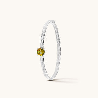 Bangle in sterling silver with champagne yellow Diaspore, upright view