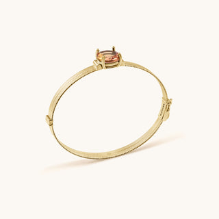Bangle in gold-plated sterling silver with lychee pink Diaspore, side view