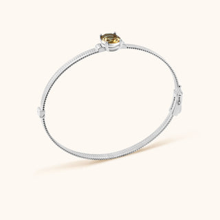 Bangle in sterling silver with champagne yellow Diaspore, side view