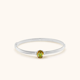 Bangle in sterling silver with champagne yellow Diaspore, laid flat