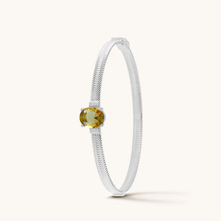 Bangle in sterling silver with champagne yellow Diaspore, upright view