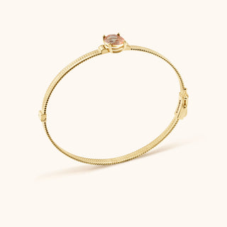 Bangle in gold-plated sterling silver with lychee pink Diaspore, side view
