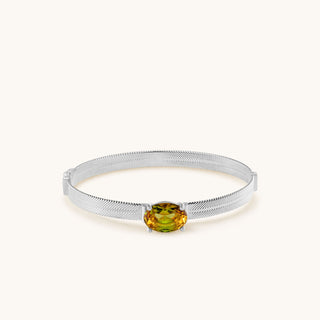 Bangle in sterling silver with champagne yellow Diaspore, laid flat
