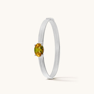 Bangle in sterling silver with champagne yellow Diaspore, upright view