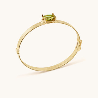 Bangle in gold-plated sterling silver with kiwi green Diaspore, side view