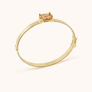 Bangle in gold-plated sterling silver with lychee pink Diaspore, side view