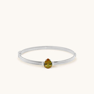 Bangle in sterling silver with champagne yellow Diaspore, laid flat
