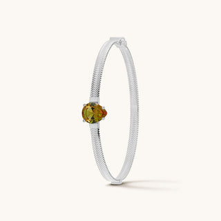Bangle in sterling silver with champagne yellow Diaspore, upright view