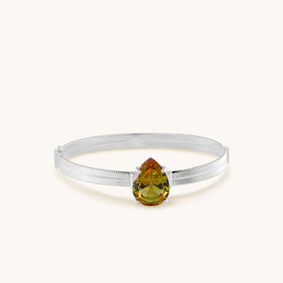 Bangle in sterling silver with champagne yellow Diaspore, laid flat