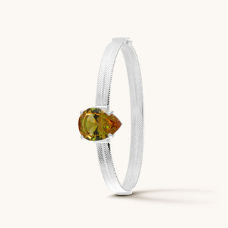 Bangle in sterling silver with champagne yellow Diaspore, upright view
