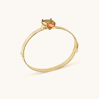 Bangle in gold-plated sterling silver with lychee pink Diaspore, side view
