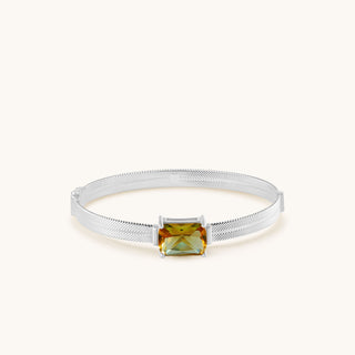 Bangle in sterling silver with champagne yellow Diaspore, laid flat