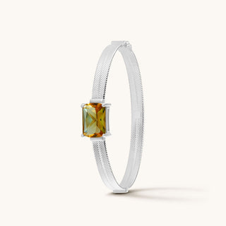 Bangle in sterling silver with champagne yellow Diaspore, upright view