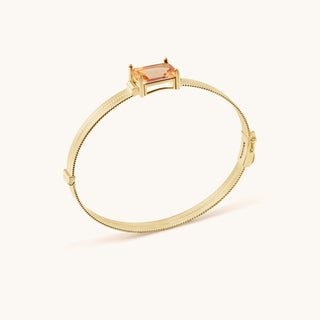 Bangle in gold-plated sterling silver with lychee pink Diaspore, side view