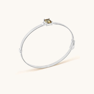 Bangle in sterling silver with champagne yellow Diaspore, side view