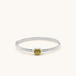 Bangle in sterling silver with champagne yellow Diaspore, laid flat