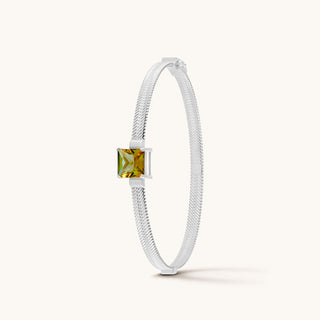 Bangle in sterling silver with champagne yellow Diaspore, upright view